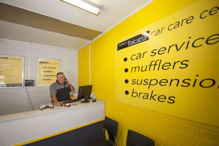 receptionist answering the phone in adrian's balcatta car care centre foyeur